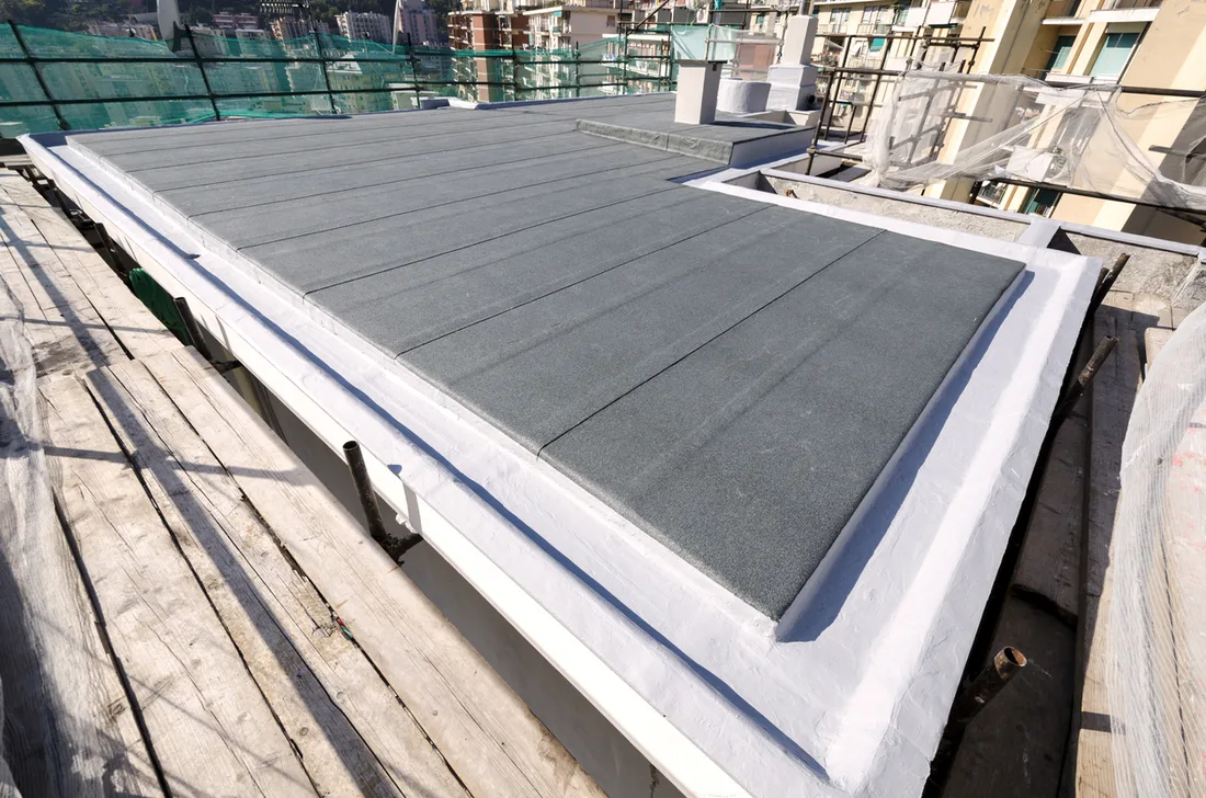 Flat roof with new waterproof membrane on a commercial building